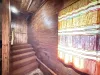 Upon entry of the cabin there are stairs that lead to the bedroom, bathroom, and kitchen.