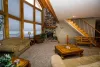Living room main floor with seating and lots of natural light.