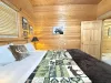 Welcome to the second bedroom with a queen size bed.