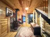 Entryway with gas fireplace and stairs. Gas fireplace to keep you warm during your stay.