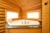 The master bedroom has a jetted tub attached to it.