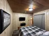 Queen bedroom with flat screen smart tv