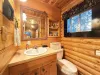 Upstairs half bathroom with sink and toilet.