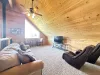 The loft has seating on a couch and a table.