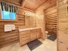 Main level bathroom with shower/tub, toilet, and sink.