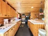 Full kitchen with counter space, appliances, and basic spices.