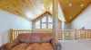 This cabin features large windows that let light in during the day.