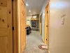 Hallway in the basement to access the living area and bedrooms.
