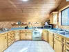 Upstairs garage apartment kitchen. Full kitchen with appliances, dishes, and basic cooking needs.