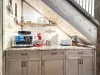 Kitchen rear counter space with microwave and kitchenaid mixer.