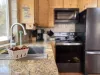 The kitchen in this cabin exudes warmth and practicality, designed for both comfort and functionality.