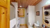 Downstairs full size bathroom with a stacked washer and dryer. Laundry soap is also provided.