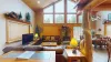 Imagine stepping into a cozy yet expansive open living room in a cabin, where rustic charm meets modern comfort.
