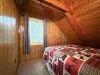 Bedroom #3 located upstairs with a queen size bed.