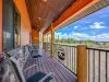 Front Deck with seating and view of the landscape beyond.