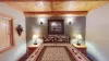 Picture a cozy bedroom in a cabin, where natural materials and soft lighting create a peaceful, retreat-like vibe.