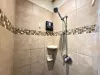 The standing shower is equipped with shampoo, conditioner, and body wash for you to use.