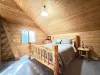 Bedroom located upstairs with a king size bed. Ladder loft with twin size bunk beds.