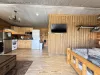Open living room that flows into the kitchen for easy communication.