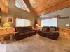 Living room with open windows to let in lots of natural light.