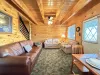 Comfortable leather furniture in main living room with mountain views
