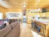 View from the entryway highlighting the open concept of kitchen and living area.