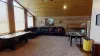 Upstairs loft is equipped with sectional couch, satellite tv, and foosball table.