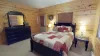 The master also has direct access to the deck and a dresser.