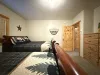Bedroom #1 located in the basement, equipped with 2 Queen size beds.