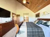 Master bedroom located on the main floor with a King size bed.