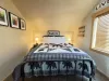 Upstairs bedroom with a queen bed.