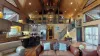 The open kitchen blends seamlessly into the cabin's cozy living area, creating a welcoming space perfect for gathering and unwinding.
