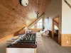 Large loft space with lots of natural light during the day from the windows.