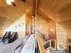 The loft has beautiful large windows to enjoy the view of the cabin.