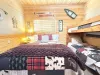 Welcome to the third bedroom with a queen bed and 2 twin beds on a bunk bed.