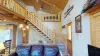 Access to the loft, upstairs bedroom, and bathroom are accessible through the stairs pictured here.