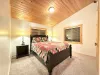 Bedroom #6 located upstairs with a Queen size bed.