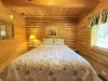 Bedroom #2 located on the main floor with a Queen size bed.