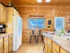 The open layout of the kitchen blends seamlessly into the other areas of the cabin.