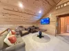 Upstairs loft with tv and seating.
