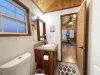 Full size bathroom with shower/tub, toilet, and sink vanity.