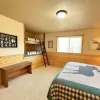 This room is equipped with a queen bed and a built in bunk bed with 2 twin beds.