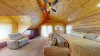 A comfortable couch sits along below the bed, offering a relaxing spot to unwind or enjoy a good book.