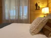 The bedroom offer a peaceful, rustic environment that blends the beauty of the cabin’s natural surroundings with the comfort and warmth needed for a relaxing stay.