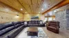 The couch is big enough to seat several people, with soft cushions and throws that add to the relaxed atmosphere.