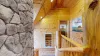 From the top of the stairs you can appreciate the beautiful stone from the fireplace.