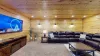 The tv is located across from the couch to be able to relax after a long day in the park.