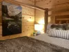The lighting is soft and inviting, with overhead lighting in the ceiling and a few decorative touches that add character to the room.