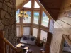 Upstairs from the loft there is a beautiful view of the living room with views of landscape from the large windows.
