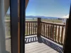 The room has easy access to a private upstairs deck through a set of French doors. The deck offers a peaceful outdoor space, where you can enjoy fresh air and take in the views of the surrounding wilderness.